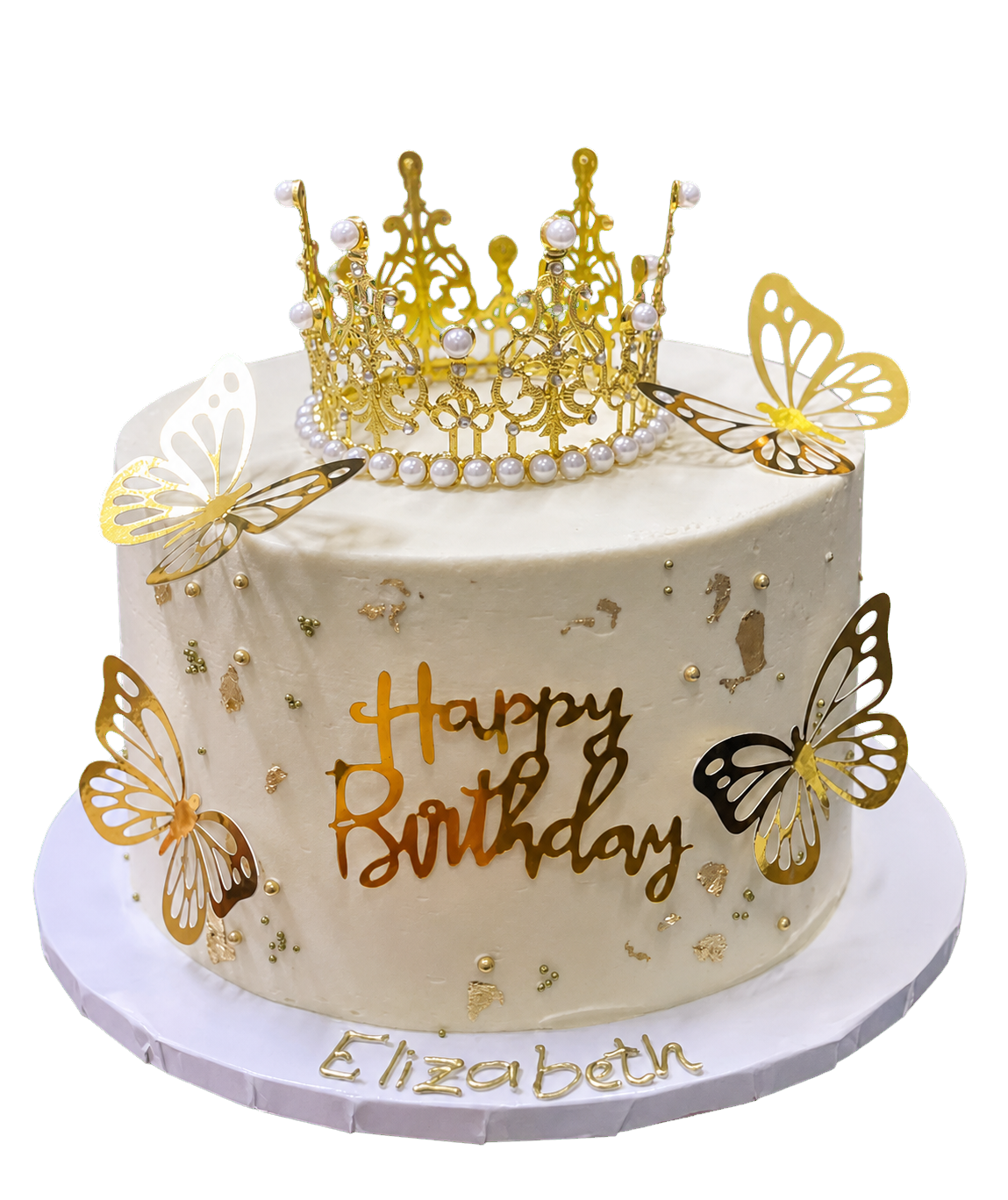 Torta de cumpleaños de Elizabeth decorada con una corona y mariposas doradas